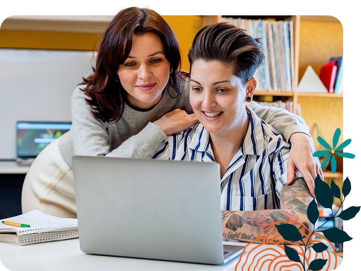 Lesbian couple exploring All Families Surrogacy resources page